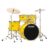 Yellow Tama drum set on a white background