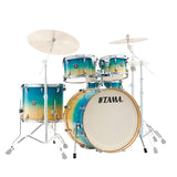 Tama drum set with gradient blue and orange finish on a white background