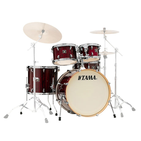 Tama drum set with red finish on a white background